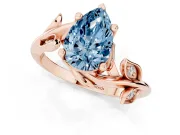 Fancy Blue Pear Cut Diamond Solitaire Twist Engagement Ring Set in Rose gold with Pavé Leaf Accents
