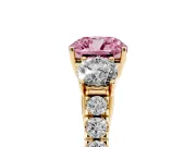 Fancy Pink Cushion Cut Diamond Three-Stone Ring Set in Yellow gold with Round Side Stones and Delicate Pavé Band
