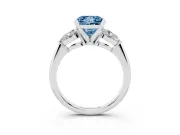 Fancy Blue Three-Stone Princess Cut Diamond Ring Set in White gold with Pear Side Stones and Prong Setting