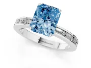 Fancy Blue Radiant Cut Diamond Solitaire Ring Set in White gold with Channel-Set Baguette Band and Prong Setting