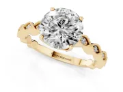 Round Cut Diamond Solitaire Ring Set in Yellow gold with Infinity Twist Pavé Band