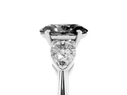 Fancy Black Three-Stone Oval Cut Diamond Ring Set in White gold with Pear Side Stones and Prong Setting