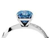 Fancy Blue Radiant Cut Diamond Engagement Ring Set in Silver with Side Stone Accents and Prong Setting