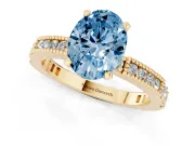 Fancy Blue Oval Cut Diamond Solitaire Ring Set in Yellow gold with Slim Pavé Band and Prong Setting