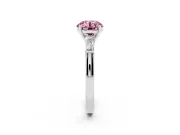 Fancy Pink Round Cut Diamond Solitaire Ring Set in White gold with Tapered Baguette Side Stones and Prong Setting