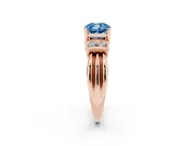 Fancy Blue Three-Stone Cushion Cut Diamond Channel Set Ring Set in Rose gold with Bar Prongs