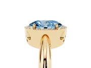 Fancy Blue Oval Cut Diamond Halo Engagement Ring Set in Yellow gold with Plain Split Shank and Prong Setting
