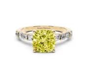 Fancy Yellow Cushion Cut Diamond Solitaire Set in Yellow gold with Side Baguettes and Channel Set Band
