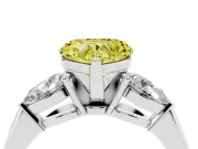 Fancy Yellow Three-Stone Heart Cut Diamond Ring Set in Platinum with Pear Side Stones and Prong Setting