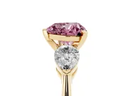 Fancy Pink Three-Stone Heart Cut Diamond Ring Set in Yellow gold with Pear Side Stones and Prong Setting