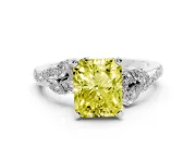 Fancy Yellow Radiant Cut Diamond Solitaire Ring Set in White gold with Marquise Twist Band and Prong Setting