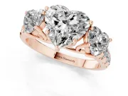 Heart Cut Diamond Three-Stone Ring Set in Rose gold with Pavé Band