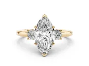 Three-Stone Marquise Cut Diamond Ring Set in Yellow gold with Prong Setting and Plain Band