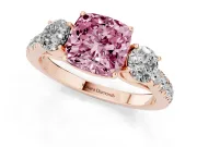 Fancy Pink Cushion Cut Diamond Three-Stone Ring Set in Rose gold with Round Side Stones and Delicate Pavé Band