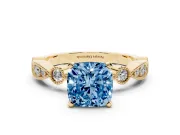 Fancy Blue Cushion Cut Diamond Solitaire Engagement Ring Set in Yellow gold with Milgrain Bezel Accent Band