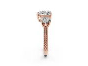 Heart Cut Diamond Three-Stone Ring Set in Rose gold with Milgrain Band