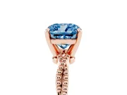 Fancy Blue Cushion Cut Diamond Solitaire Ring Set in Rose gold with Twisted Band and Bead Prong Setting