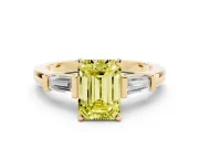 Fancy Yellow Emerald Cut Diamond Solitaire Ring Set in Yellow gold with Tapered Baguette Accents and Prong Setting