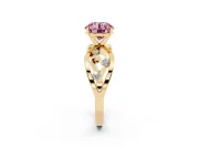 Fancy Pink Round Cut Diamond Solitaire Ring Set in Yellow gold with Side Stones on Criss-Cross Band and Prong Setting
