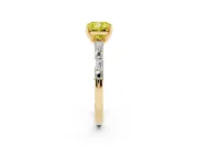Fancy Yellow Cushion Cut Diamond Solitaire Set in Yellow gold with Side Baguettes and Channel Set Band