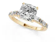 Cushion Cut Diamond Solitaire Set in Yellow gold with Side Baguettes and Channel Set Band