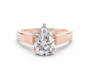 Pear Cut Diamond Solitaire Engagement Ring Set in Rose gold with Prong Setting and Tapered Band