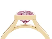 Fancy Pink Bezel Set Radiant Cut Diamond Solitaire Ring Set in Yellow gold with Tapered Band