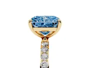 Fancy Blue Radiant Cut Diamond Solitaire Ring Set in Yellow gold with Round Pavé Band and Prong Setting