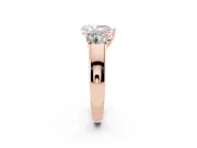Three-Stone Pear Cut Diamond Ring Set in Rose gold with Matching Prong Settings and Plain Band