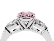 Fancy Pink Three-Stone Oval Cut Diamond Ring Set in Platinum with Pear Side Stones and Prong Setting