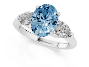 Fancy Blue Three-Stone Oval Cut Diamond Ring Set in Silver with Pear Side Stones and Prong Setting