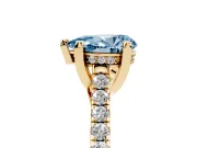 Fancy Blue Pear Cut Diamond Solitaire Ring Set in Yellow gold with Brilliant Pavé Band and Prong Setting