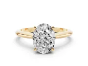 Oval Cut Diamond Solitaire Ring Set in Yellow gold with Prong Setting on a Plain Round Band