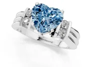 Fancy Blue Three-Stone Heart Cut Diamond Channel Set Ring Set in Platinum with Bar Prongs