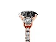 Fancy Black Round Cut Diamond Three-Stone Ring Set in Rose gold with Pavé Band and Graduated Sides