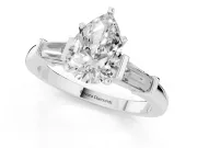 Pear Cut Diamond Solitaire Ring Set in Platinum with Tapered Baguette Accents and Prong Setting