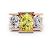 Fancy Yellow Oval Cut Diamond Three-Stone Channel Set Ring Set in Rose gold with Smooth Polished Band