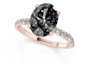 Fancy Black Oval Cut Diamond Solitaire Ring Set in Rose gold with Round Pavé Band and Prong Setting