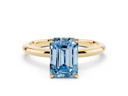 Fancy Blue Emerald Cut Diamond Solitaire Engagement Ring Set in Yellow gold with Prong Setting and Polished Band