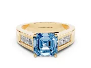 Fancy Blue Asscher Cut Diamond Solitaire Ring Set in Yellow gold with Channel-Set Accent Stones and Prong Setting