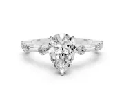 Pear Cut Diamond Solitaire Ring Set in Platinum with Bezel Set Side Stones and Prong Setting
