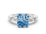 Fancy Blue Radiant Cut Diamond Solitaire Ring Set in Silver with Tapered Baguette Side Stones and Prong Setting