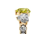 Fancy Yellow Heart Cut Diamond Three-Stone Ring Set in Yellow gold with Pavé Band