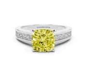 Fancy Yellow Cushion Cut Diamond Solitaire Ring Set in White gold with Channel-Set Band and Prong Setting