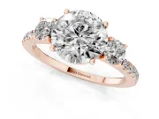 Round Cut Diamond Three-Stone Ring Set in Rose gold with Pavé Band and Graduated Sides