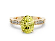 Fancy Yellow Oval Cut Diamond Solitaire Ring Set in Yellow gold with Slim Pavé Band and Prong Setting