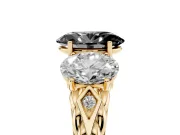 Fancy Black Oval Cut Diamond Three-Stone Ring Set in Yellow gold with Braided Band