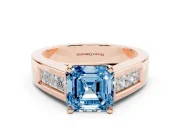 Fancy Blue Asscher Cut Diamond Solitaire Ring Set in Rose gold with Channel-Set Accent Stones and Prong Setting
