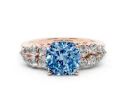 Fancy Blue Cushion Cut Diamond Cluster Engagement Ring Set in Rose gold with Pavé Band and Prong Setting