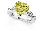 Fancy Yellow Heart Cut Diamond Twist Band Solitaire Ring Set in Platinum with Leaf Prong Setting and Accent Stones